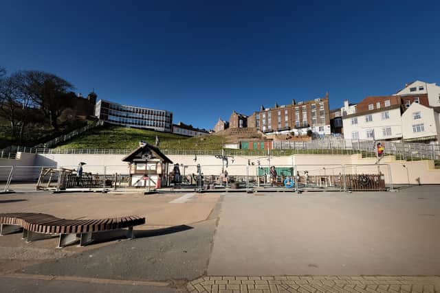 The Futurist Theatre's former site now lies almost empty, with just a crazy golf attraction ahead of the observation wheel's return.