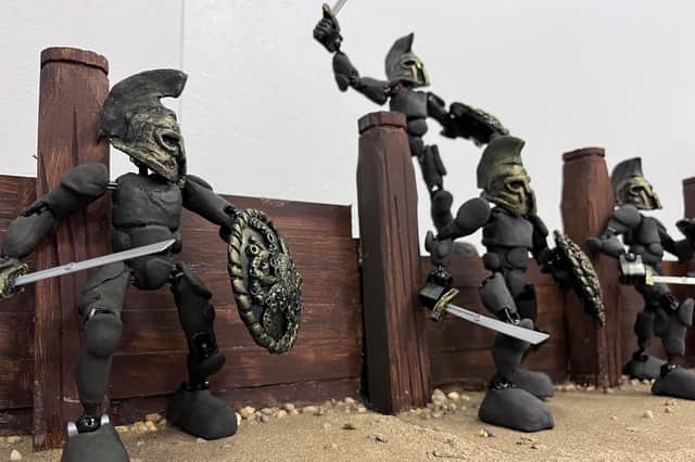 You will be able to see displays of miniature sets; weapons; props and armour from the future version of Troy