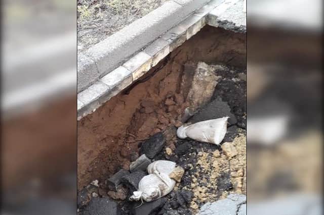 A suspected sewer collapse causes 20ft sinkhole on Stepney Road, Scarborough.