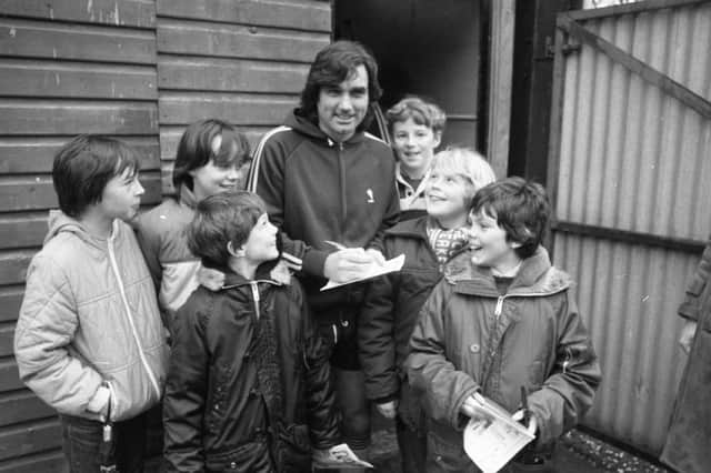 George Best turned up... and so did over 1,000 eager fans who wanted to see the former soccer wizard in action again. And Best treated them to an unforgettable afternoon as he turned on the old style in a special fund raising match at Lytham. Best was in a Lytham FC Chairman's XI who took on the present Lytham FC side to raise money for ground improvements at Ballam Road. Delighted youngsters queue up for Best's autograph