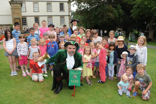 Youngsters celebrate Yorkshire Day with the chairman of the East Riding Pat O’Neil at Sewerby Hall and Gardens in 2014. Children are pictured getting ready to enter the town crier competition. (NBFP PA1431-18e)