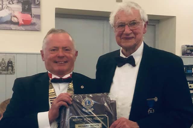 Richard Traves receives his award from North Wolds Lions president Paul Richardson.