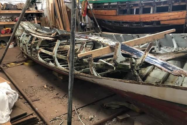 The boat’s carcass with old planks stripped out.