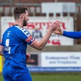 Lewis Hawkins, left, is congratulated by Josh MacDonald after scoring the first goal in the 2-2 draw at home to NPL Premier leaders Matlock Town

Photo by Brian Murfield