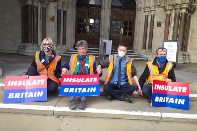 Cllr Theresa Norton (left) glued to the steps of the Royal Courts of Justice. (Photo: Insulate Britain)