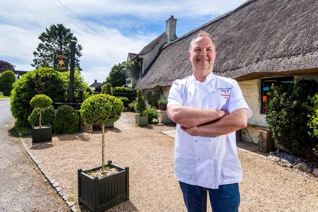 Andrew Pern pictured outside The Star at Harome last summer; the building is now closed after a devastating fire in November 2021.