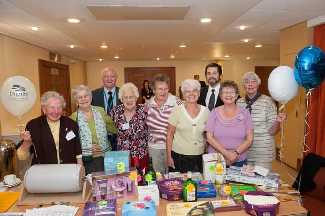 Posing for a photo at the tombola stall during Bridlington PAGER group’s ‘Older People’s Day’ at the Spa in 2014. (nbfp-msh1420x446)