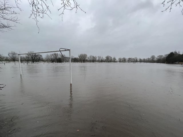 Play is definitely cancelled with this football pitch being left totally flooded.