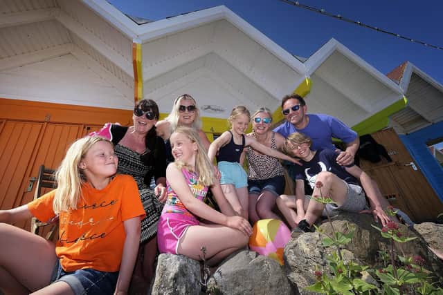 Family friends make the most of last year’s hot weather at the chalets on Scarborough’s North Bay.