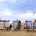 Families enjoy South Bay beach in the warm summer weather after lockdown.