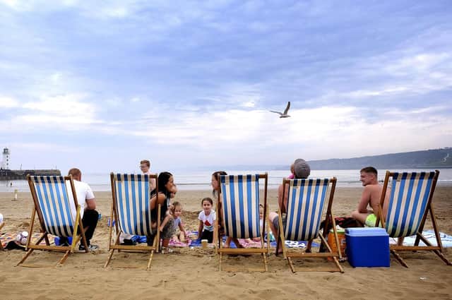 Families enjoy South Bay beach in the warm summer weather after lockdown.