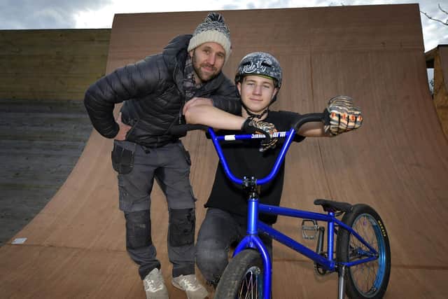 BMX star Miller Temple, right, with his dad Matt at the track that the latter built in their own back garden in Scarborough.