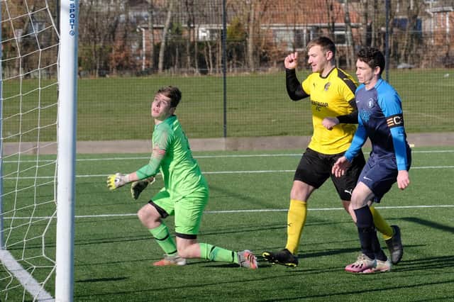 Cayton's keeper and skipper look on as Traf score during their 10-2 Sunday FA Cup win

Photo by Richard Ponter