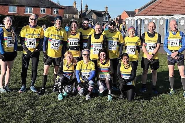 Scarborough Athletic Club runners line up before the Snake Lane 10 Mile Road Race