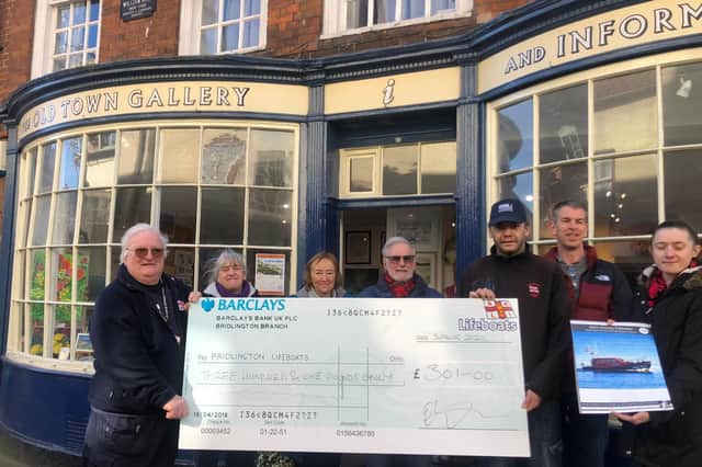 Martyn Coltman and his team presented a cheque for £301 to Bridlington RNLI following the sales of 2022 calendars at the Old Town Gallery. Photo courtesy of Bridlingtion RNLI