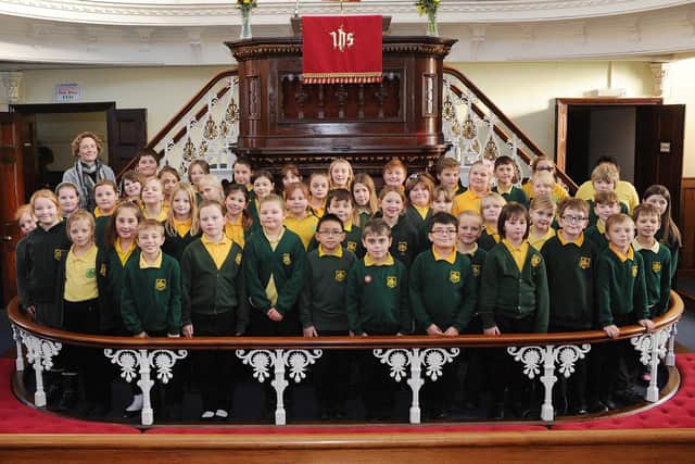 Burlington Junior School Choir members pose for the photographer during the Rotary Club of Bridlington Christmas Tree Festival opening ceremony in 2014. Do you recognise any of the people in the picture? Photo by Paul Atkinson. (NBFP PA1449-11d)