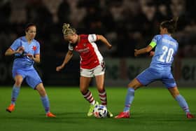 Beth Mead, of Arsenal, is challenged by Diana Bartovicova of Slavia Prague as Veronika Pincova looks on during the UEFA Women's Champions League match on August 31, 2021