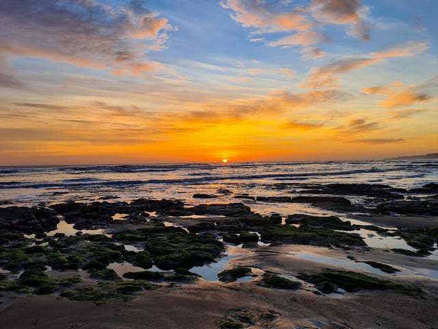 Stunning sunrise and moonscape rock pools
