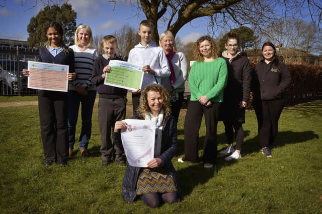 Staff and students at Woodlands Academy with their award.