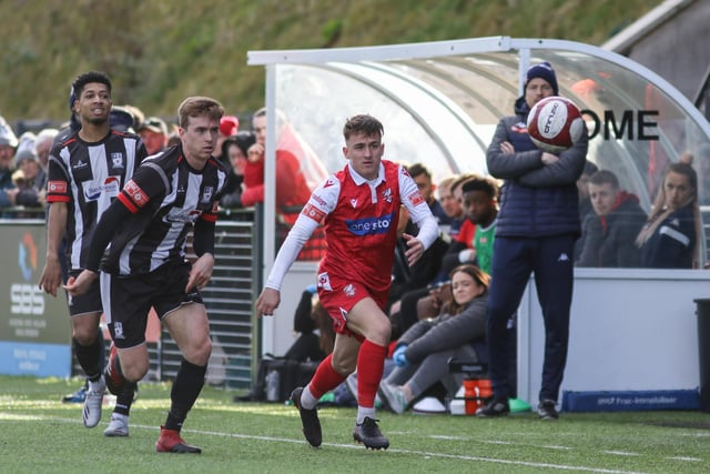 Cameron Wilson chases the ball for Scarborough at home to Stafford