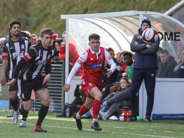 Cameron Wilson chases the ball for Scarborough at home to Stafford