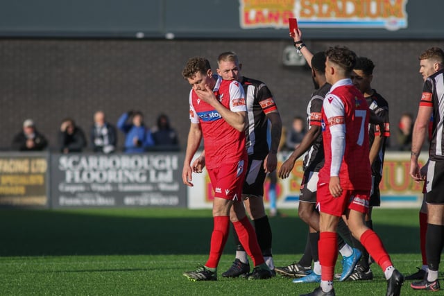 Scarborough Athletic midfielder Simon Heslop trudges off after being shown the red card for his second caution, early in the second half against Stafford