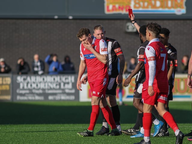 Scarborough Athletic midfielder Simon Heslop trudges off after being shown the red card for his second caution, early in the second half against Stafford