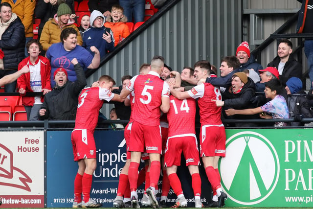 The fans and players celebrate Kieran Weledji's late leveller for Scarborough Athletic against Stafford Rangers