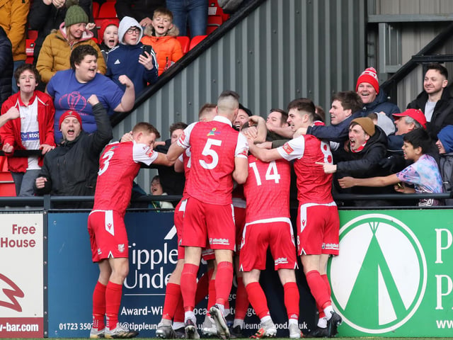 The fans and players celebrate Kieran Weledji's late leveller for Scarborough Athletic against Stafford Rangers
