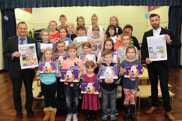 Martongate School pupils entered a drawing competition in 2014. In the picture are the winners with advertising representative Franky Woods. Do you recognise any of the people in the photograph? Photo by Paul Atkinson (NBFP PA1448-14)