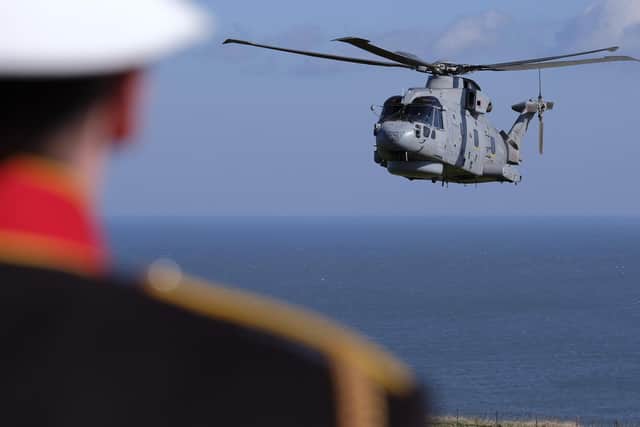 A Royal Navy Merlin helicopter performed a flypast at the event