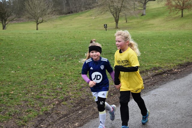 Two young runners work together at Sewerby parkrun
