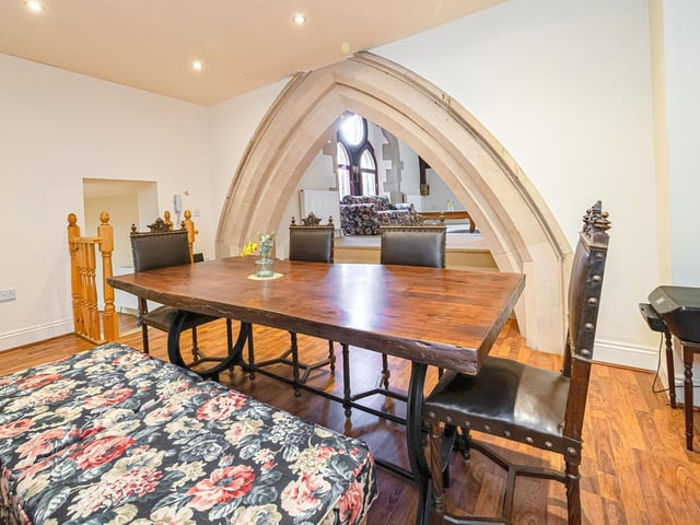 Looking through the stone archway towards the living room area.
