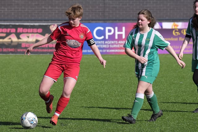 Scarborough Ladies Under-18s captain Ellie Pateman on the ball against Wigginton