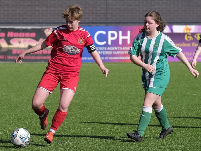 Scarborough Ladies Under-18s captain Ellie Pateman on the ball against Wigginton