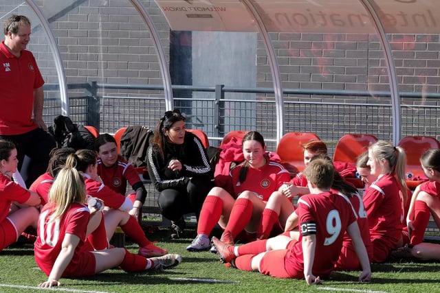 The Scarborough Ladies Under-18s players listen to their final ever half-time team talk from coach Rachel Paterson and manager Kevin Matthews