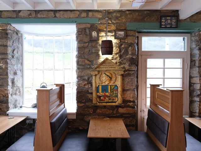The new interior features high-back booth seating.