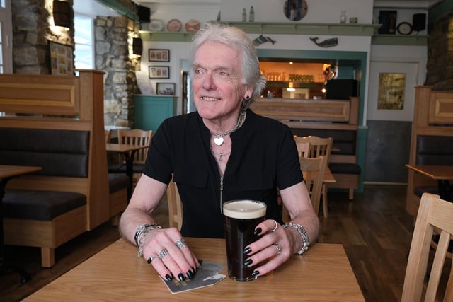Owner Keith Dufton enjoys a pint in the refurbished pub.