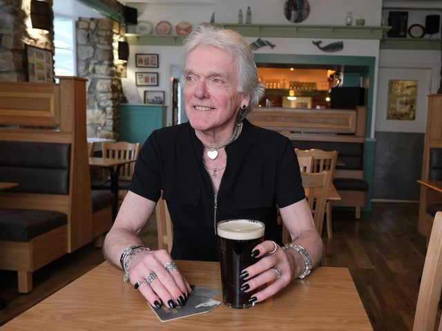 Owner Keith Dufton enjoys a pint in the refurbished pub.