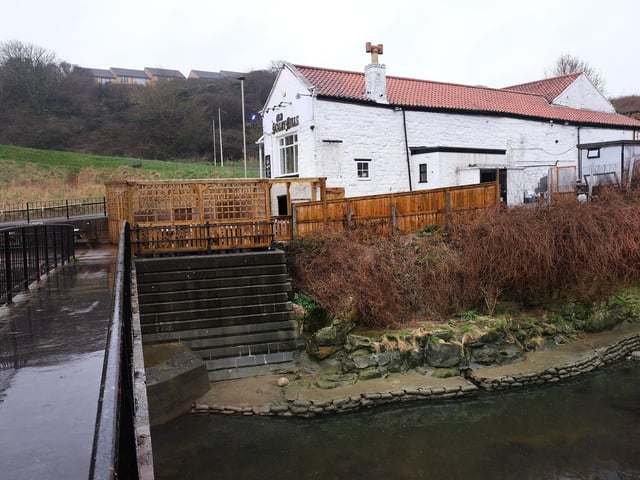 The pub's outdoor seating area next to the Sea Cut.