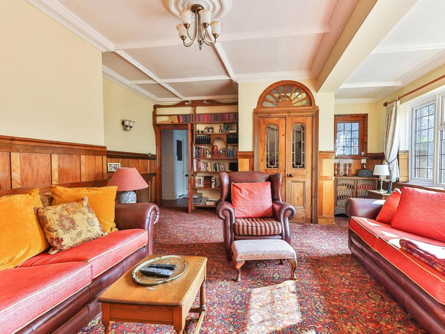 Decorative double doors within the lounge, that again, has a great deal of natural light from wide windows.