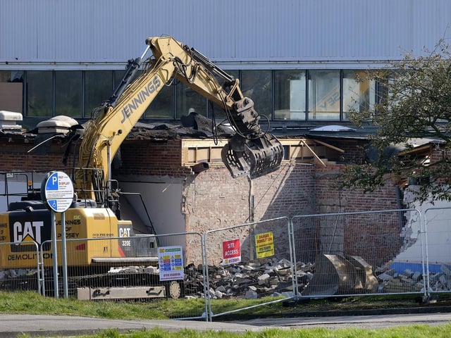 Demolition work begins.