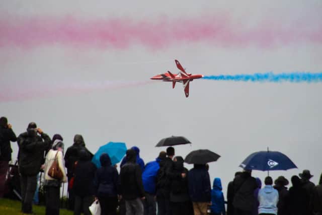 The Red Arrows perform at on a wet day at Whitby Regatta, in 2014.