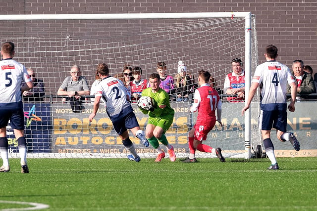 Matlock keeper Joe Young safely gathers the ball in the game at Scarborough Athletic