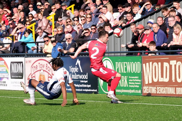 Scarborough Athletic skipper Ryan Watson comes away with the ball