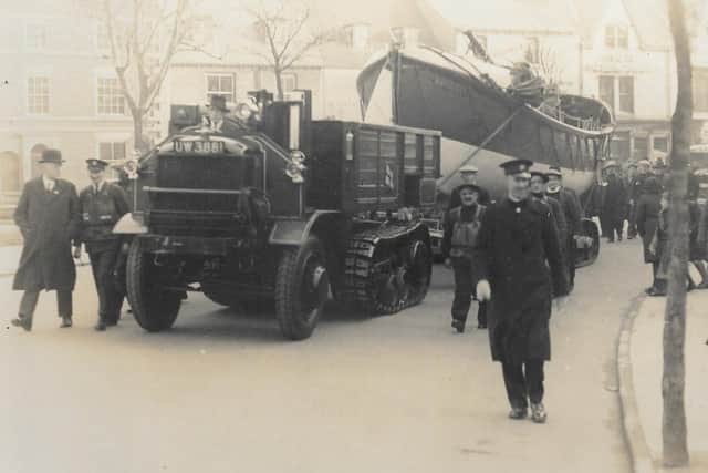 A half-track engine pulls the Bridlington Lifeboat through the streets.