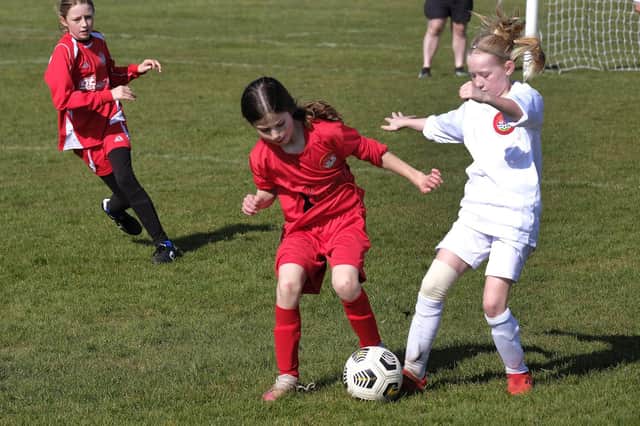 Scarborough Ladies Under-11s Reds (red kit) battle it out with hosts Scarborough Ladies Under-11s (white kit)

Photos by Richard Ponter