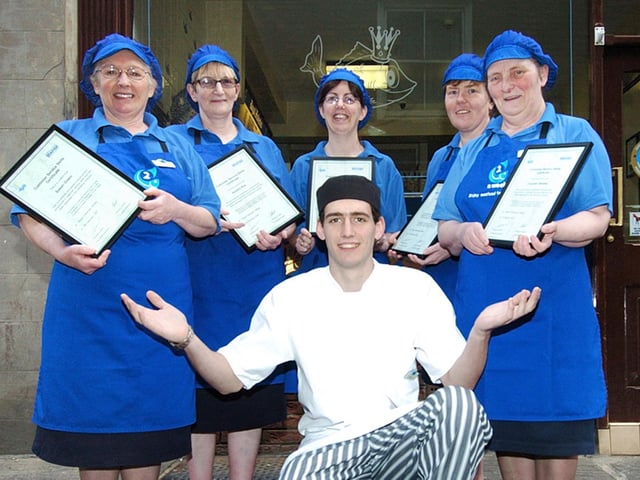 Fusco's staff are pictured with their Seafish customer care certificates with Raymond Fusco, front.