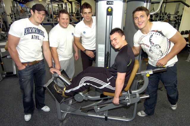 Local rugby league player Marc McNeill tries one of the Compass gym machines with, from left, Luke Burgess, Nick Burgess, Gym Director of Fitness Nick Ingham, and Sam Burgess.