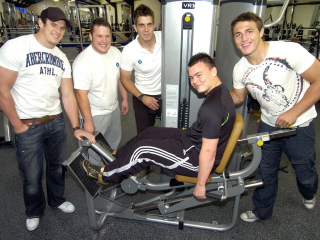 Local rugby league player Marc McNeill tries one of the Compass gym machines with, from left, Luke Burgess, Nick Burgess, Gym Director of Fitness Nick Ingham, and Sam Burgess.